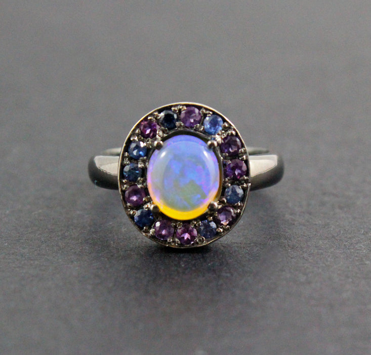 Australian jelly opal with amethyst and blue sapphire halo oxidized black gold ring