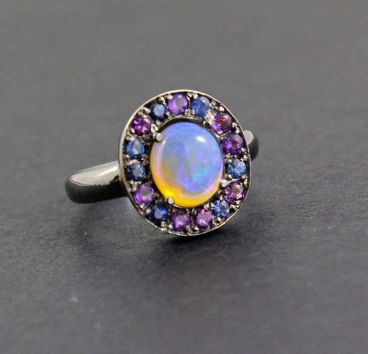 Australian jelly opal with amethyst and blue sapphire halo oxidized black gold ring