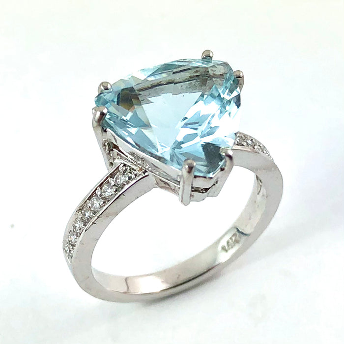 Natural untreated blue topaz trillion white gold and diamond ring